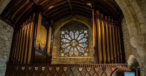 Low angle view of ornate window in historic building