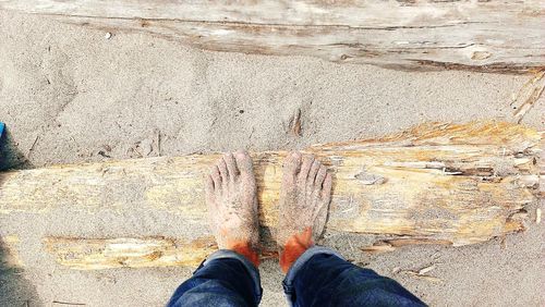 Low section of person standing on tiled floor