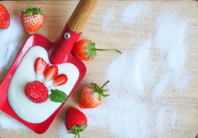 High angle view of strawberries on table