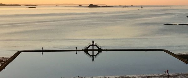 Scenic view of sea against sky at sunset