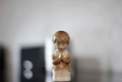 Close-up of figurine sculpture on table