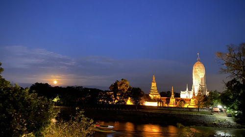 Illuminated buildings at waterfront