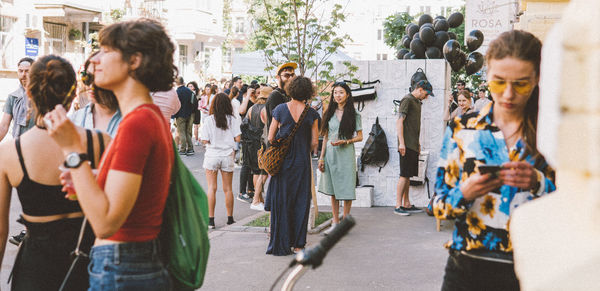 Group of people walking on city street