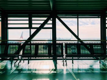 Bridge against sky seen through glass window