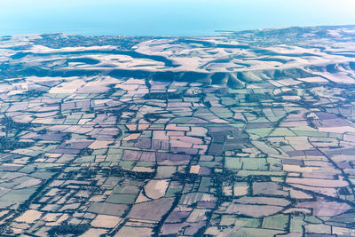 High angle view of cracked landscape against sky