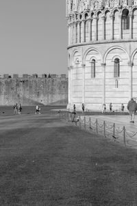 Group of people in front of historical building