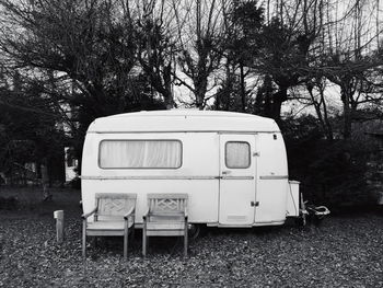 View of abandoned car on field