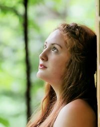 Side view of thoughtful teenage girl looking away