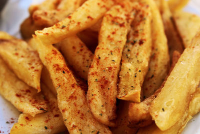 Close-up of burger and fries in plate