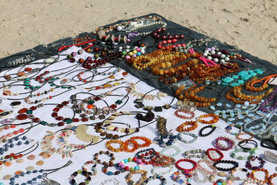 High angle view of flowers on sand at beach