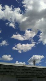 Low angle view of building against cloudy sky