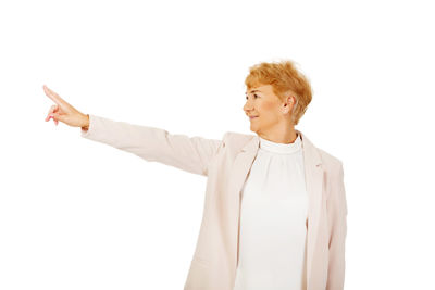 Mid adult man standing against white background