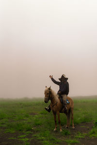 Full length of man sitting on horse