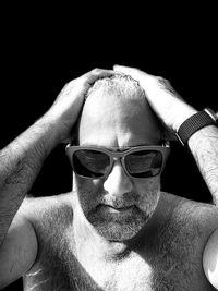 Close-up portrait of man wearing eyeglasses