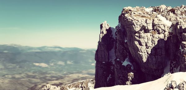 Scenic view of rock formations against sky