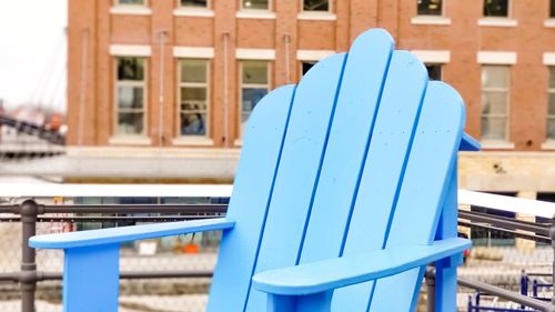 Empty blue adirondack chair