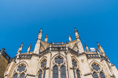 Low angle view of temple building against blue sky