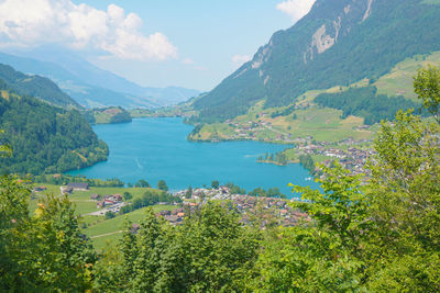 High angle view of trees and mountains against sky