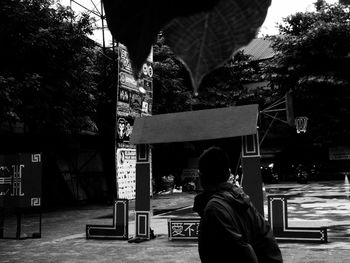 Rear view of a man walking in temple