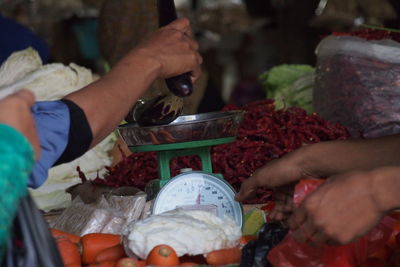 Close-up of hands holding food at market