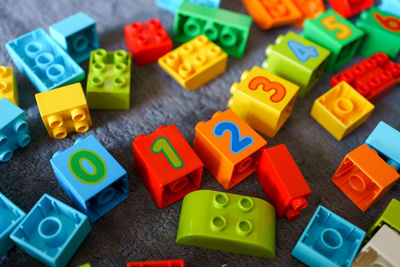 High angle view of various toys on shelf