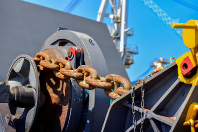 Low angle view of chain on bridge against sky