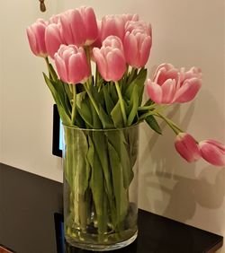 Close-up of pink roses in vase on table