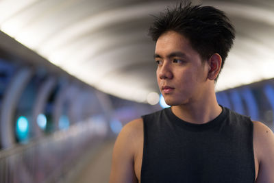 Portrait of young man looking away