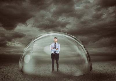 Digital composite image of young man standing on land