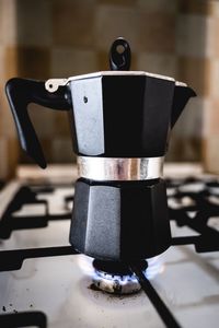 Close-up of coffee cup on table at home