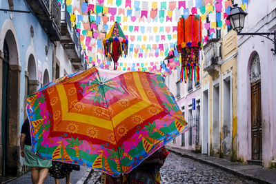 Rear view of people with umbrella