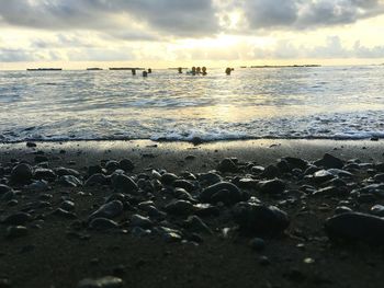 Scenic view of sea against cloudy sky