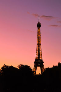 Low angle view of tower against sky during sunset