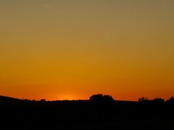 Scenic view of silhouette landscape against sky during sunset