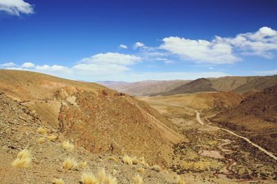 Scenic view of arid landscape against sky