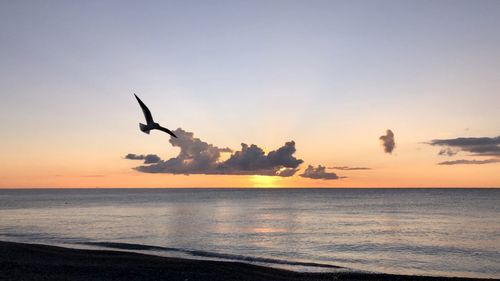 Scenic view of sea against sky during sunset