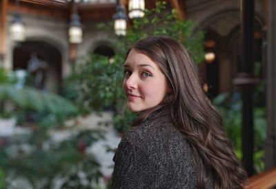 Portrait of smiling young woman with long hair