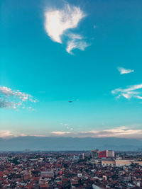 Aerial view of townscape against sky