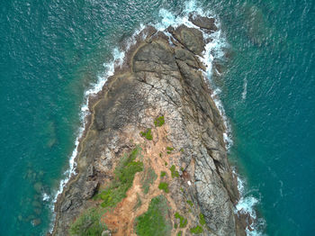 High angle view of rock formation in sea