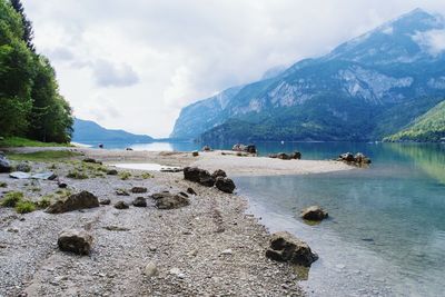 Panoramic view of sea and mountains against sky