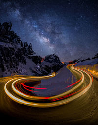 High angle view of light trails on road at night