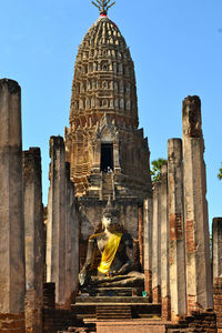 Statue in temple against clear sky