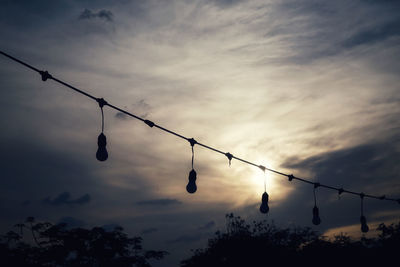 Low angle view of silhouette tree against sky at dusk