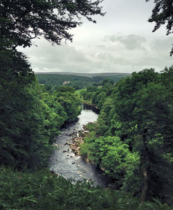 Scenic view of landscape against cloudy sky