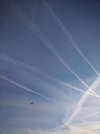 Low angle view of vapor trails in sky