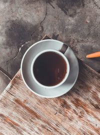 High angle view of coffee cup on table