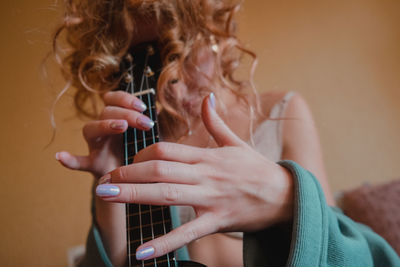 Portrait of woman holding hands