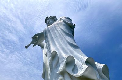 Low angle view of statue against sky