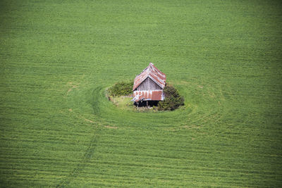 Aerial view of old barn in farm field.