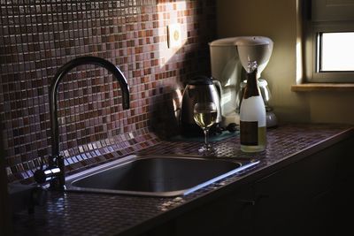 Close-up of glasses on table at home